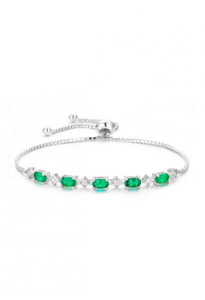 Bracciale di diamanti con gemme di smeraldo di forma ovale