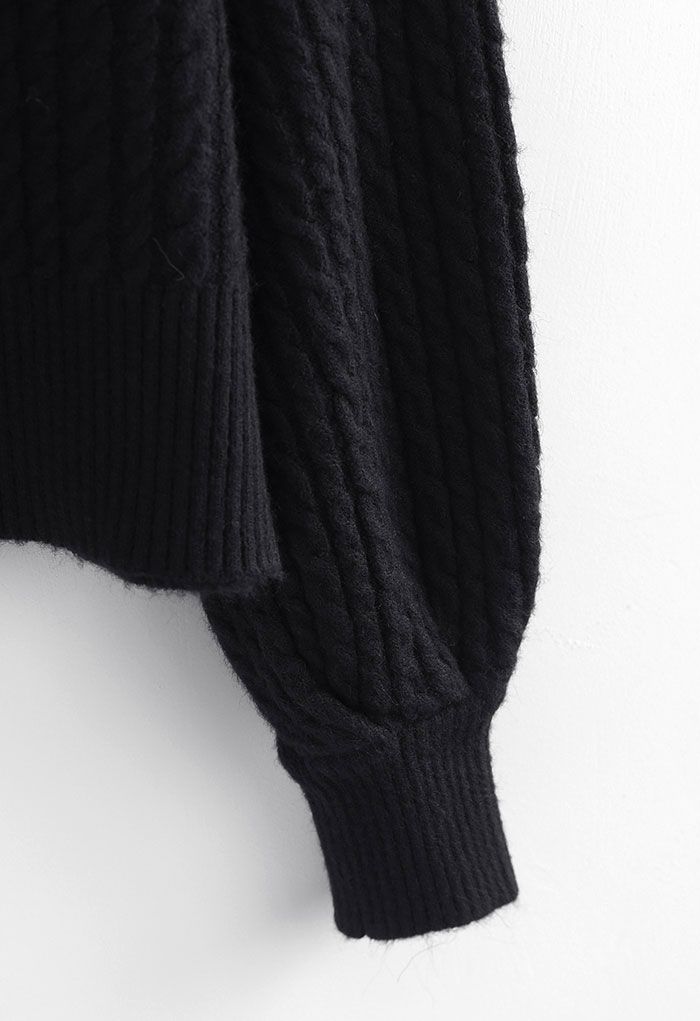 Cardigan corto abbottonato in maglia intrecciata in nero