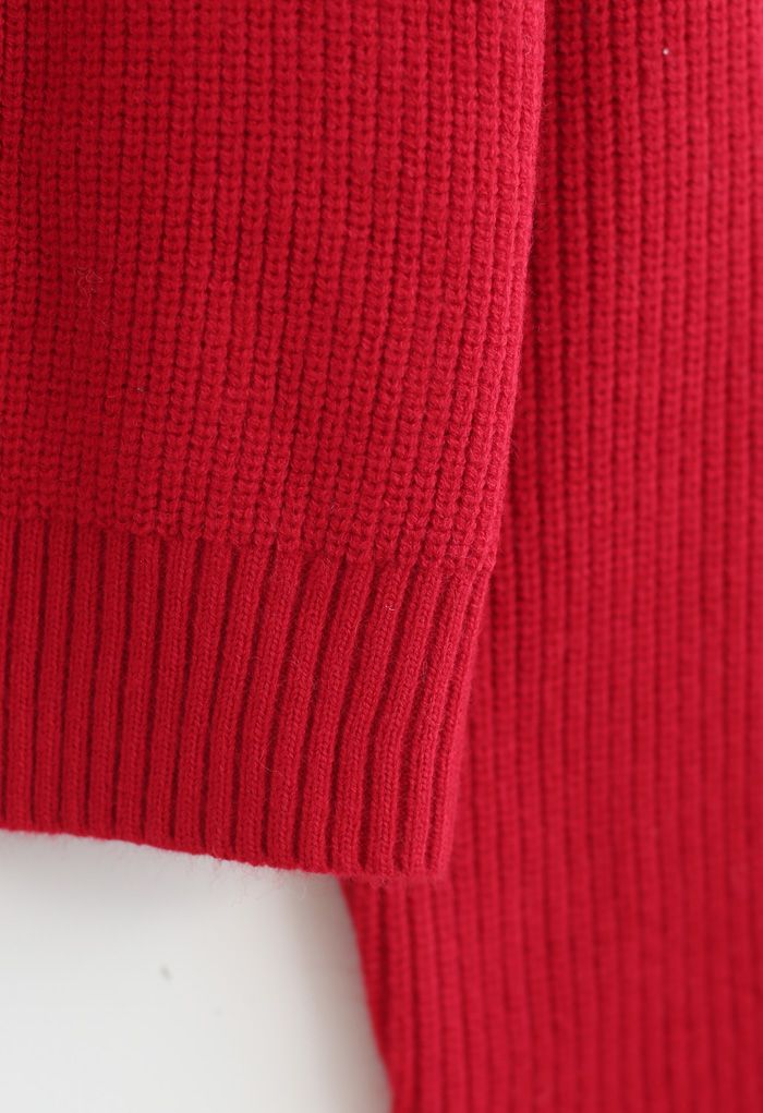 Cardigan in maglia corta con bottoni e spilla con fiocco in rosso