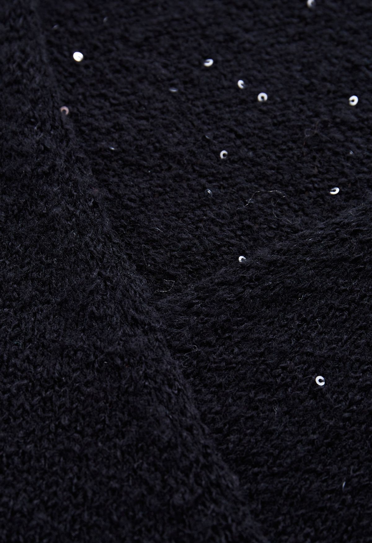 Top in maglia avvolta in leggero paillettes in nero
