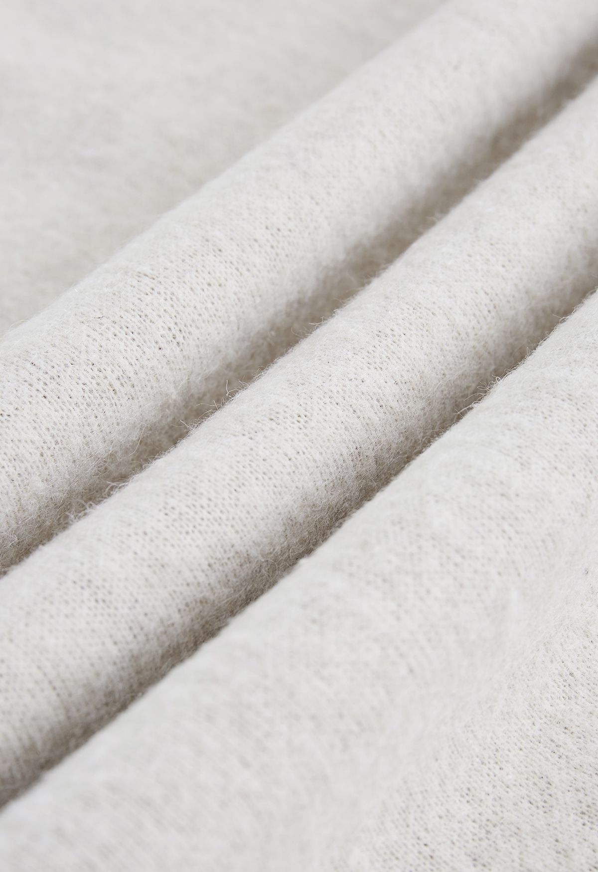 Poncho con cappuccio in pelliccia sintetica misto lana color sabbia