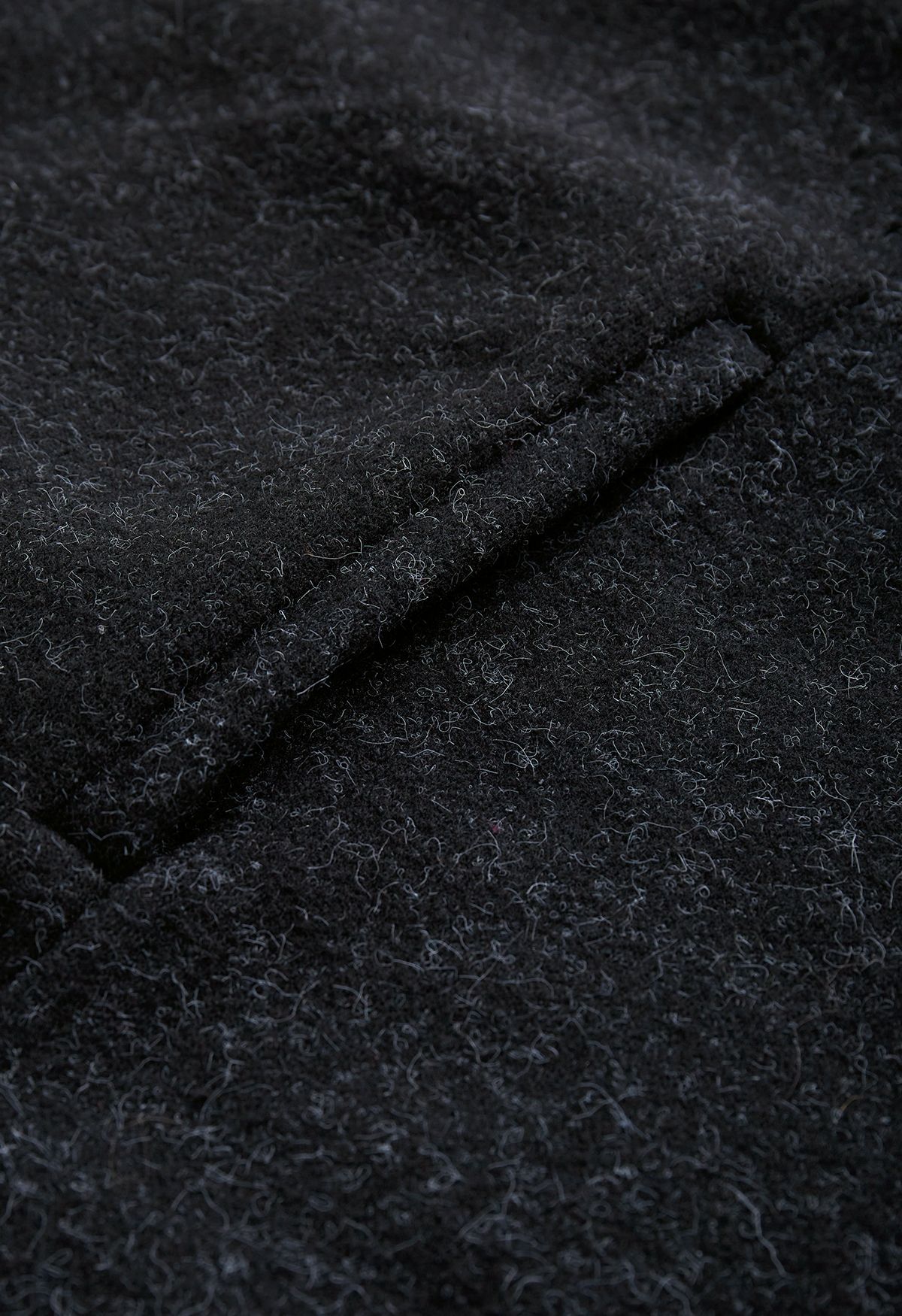 Poncho in pelliccia sintetica con fiocco da annodare in nero