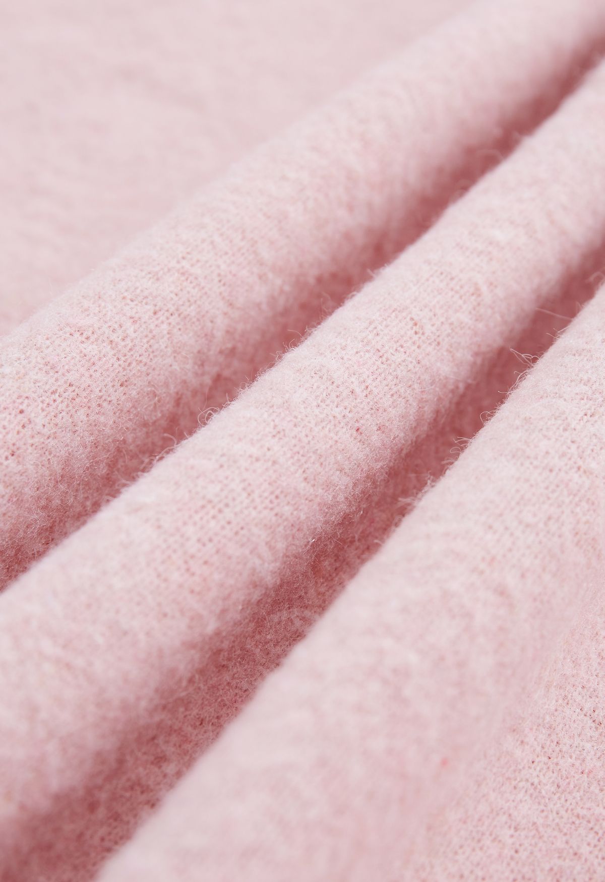 Poncho in pelliccia sintetica con fiocco da annodare in rosa
