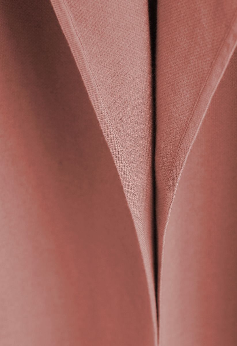 Elegante cappotto in maglia aperto sul davanti color corallo