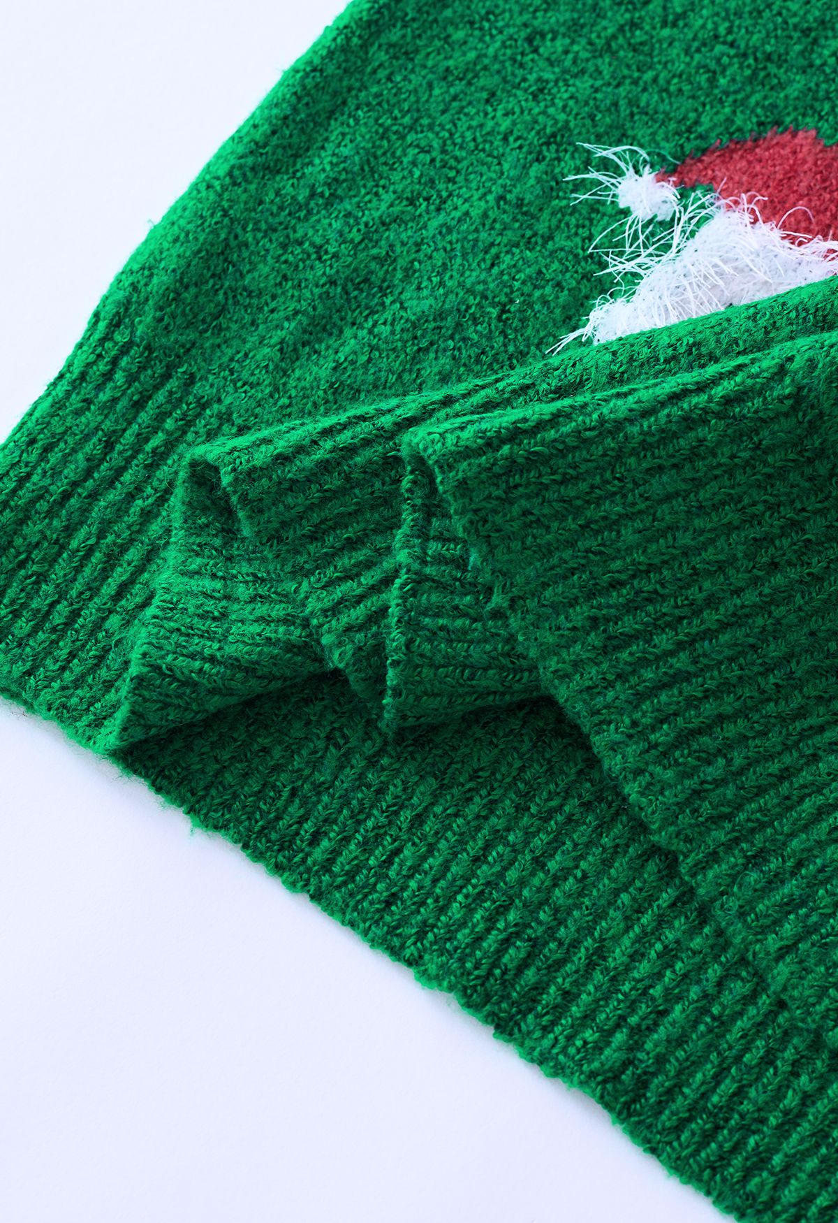 Top in maglia sfocata di Babbo Natale in verde
