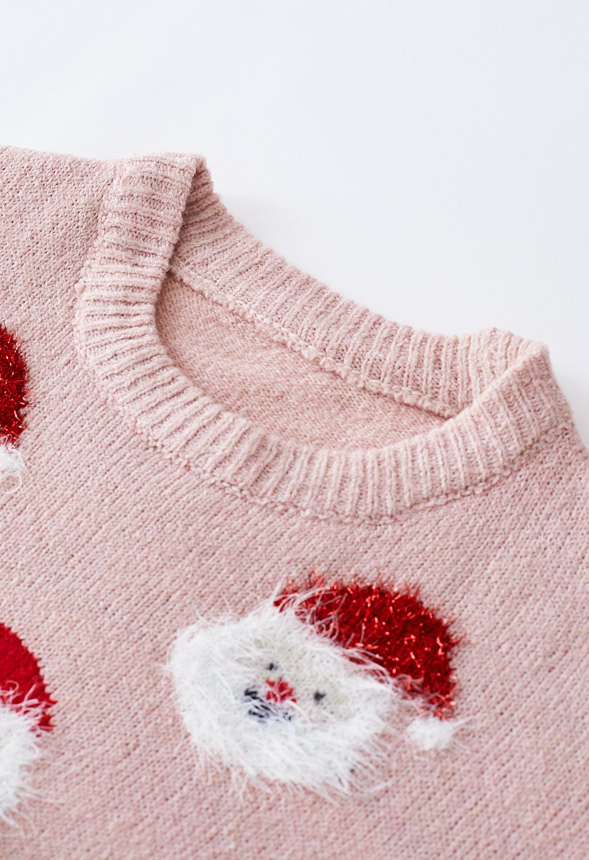 Top in maglia sfocata di Babbo Natale in rosa