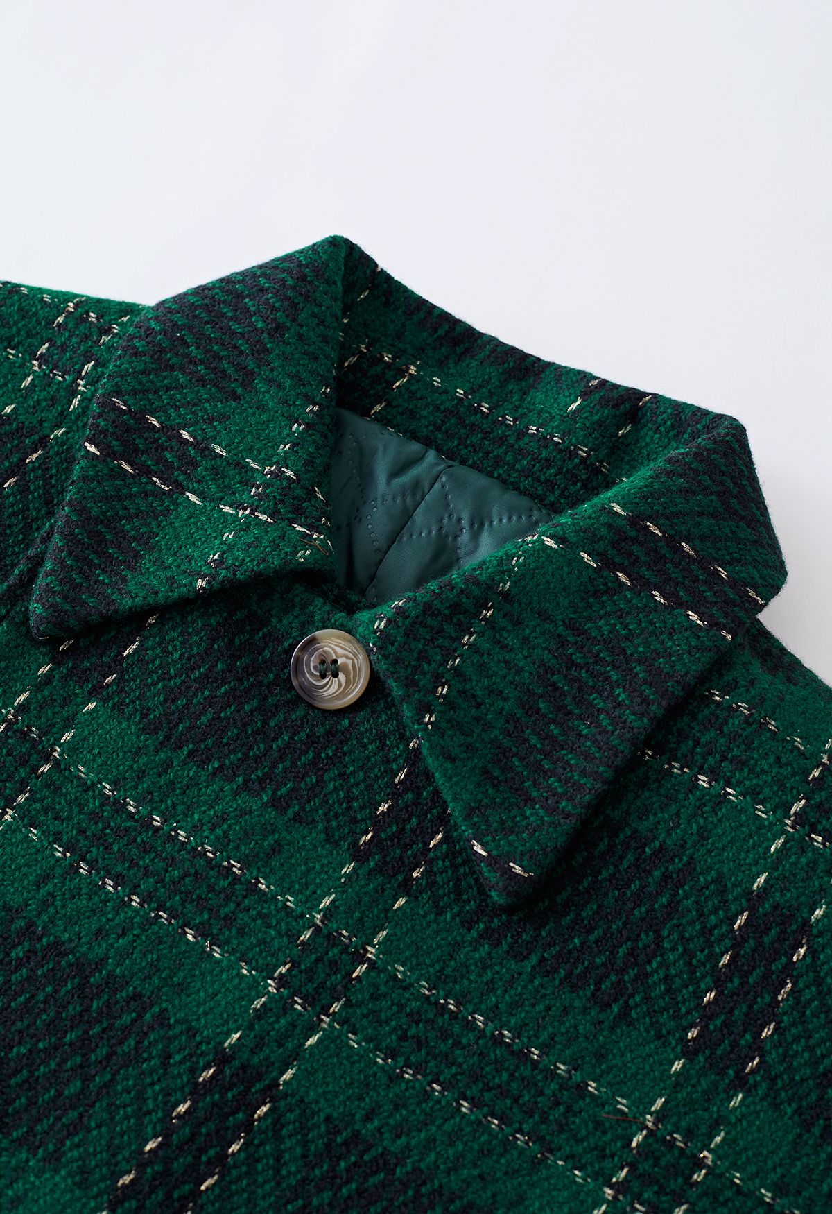 Giacca corta in tweed scozzese metallizzato e gonna a pieghe in verde