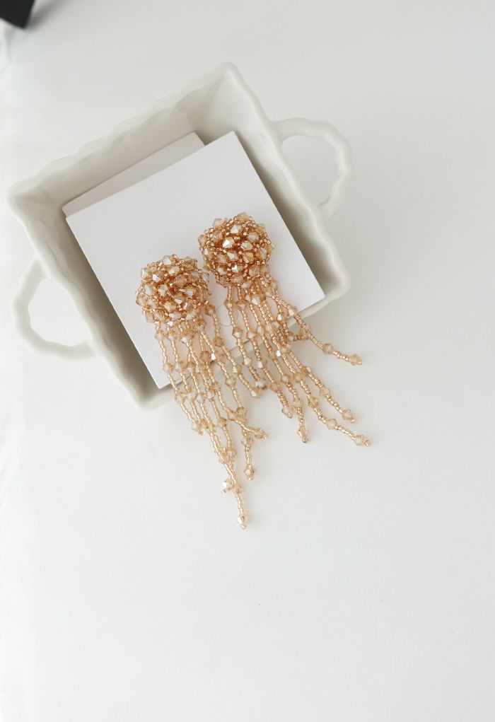 Orecchini pendenti asimmetrici con nappe con perline