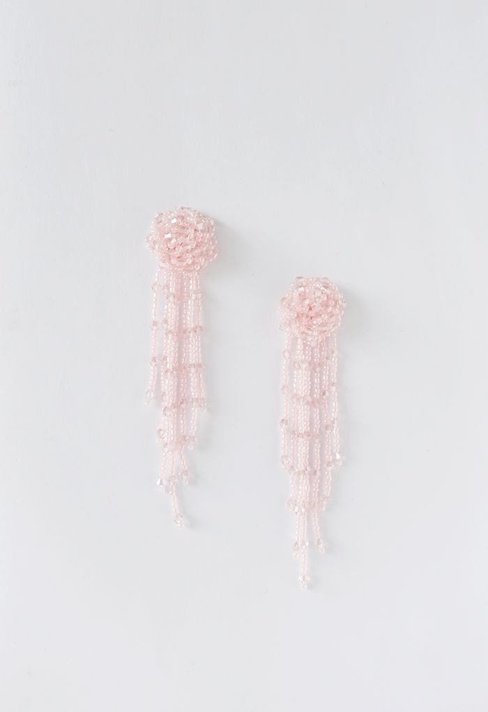 Orecchini pendenti asimmetrici con nappe con perline