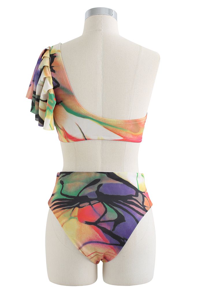Set bikini monospalla riccamente colorato