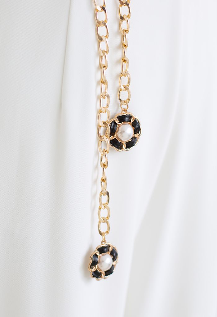 Cintura a catena dorata in ecopelle con perle floreali in nero