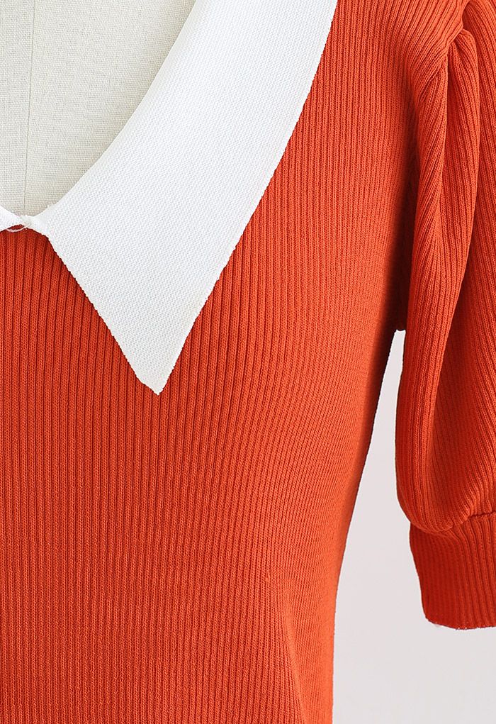 Top in maglia a maniche corte con colletto a punta a contrasto in arancione