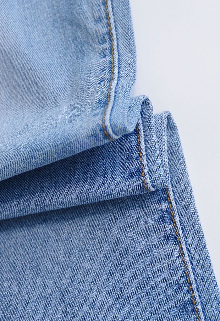 Jeans a vita alta con dettagli strappati
