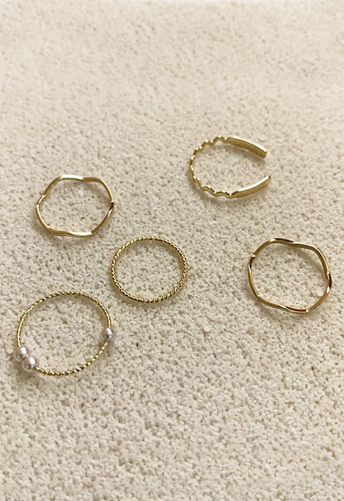 Anelli d'oro con perle semplici a cinque pezzi