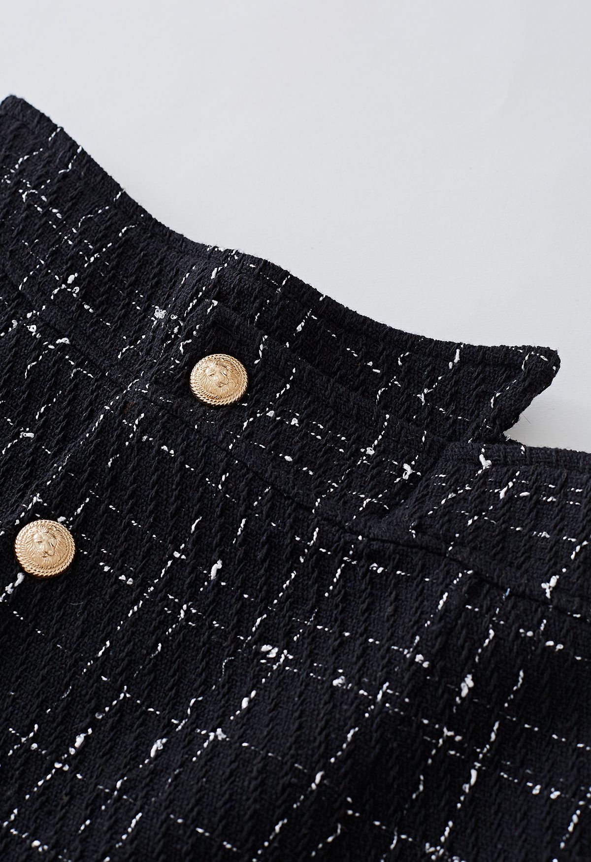 Skorts con patta abbottonata in tweed a griglia in nero