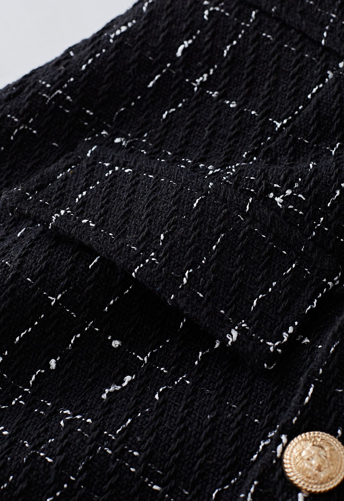 Skorts con patta abbottonata in tweed a griglia in nero