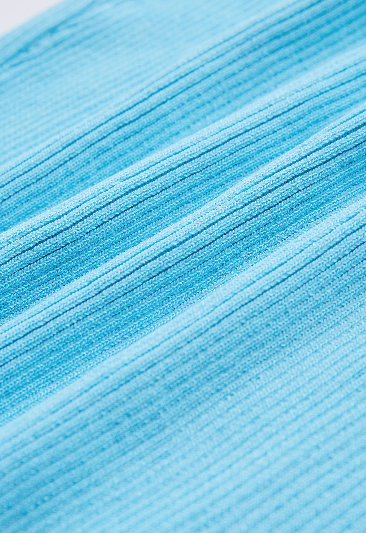Canotta corta in maglia perlata color azzurro baby