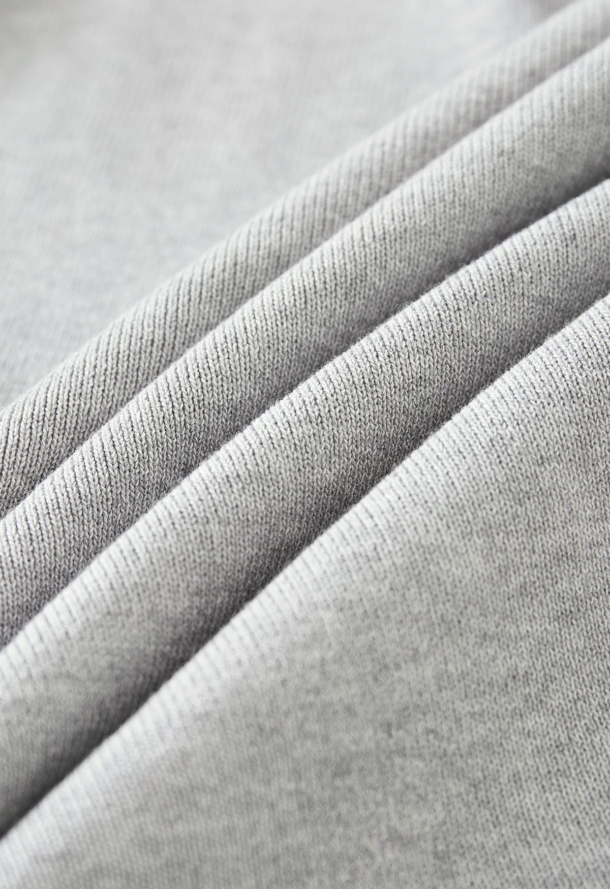 Cardigan in maglia a vita alta con risvolto largo in grigio