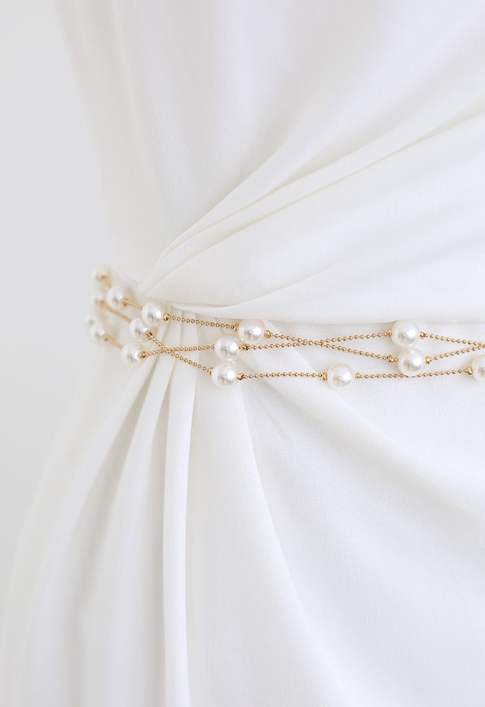 Cintura a catena dorata con strati di perle