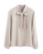 Camicia button down con fiocco luccicante color crema
