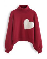 Maglione in maglia a collo alto con cuore ricamato in rosso